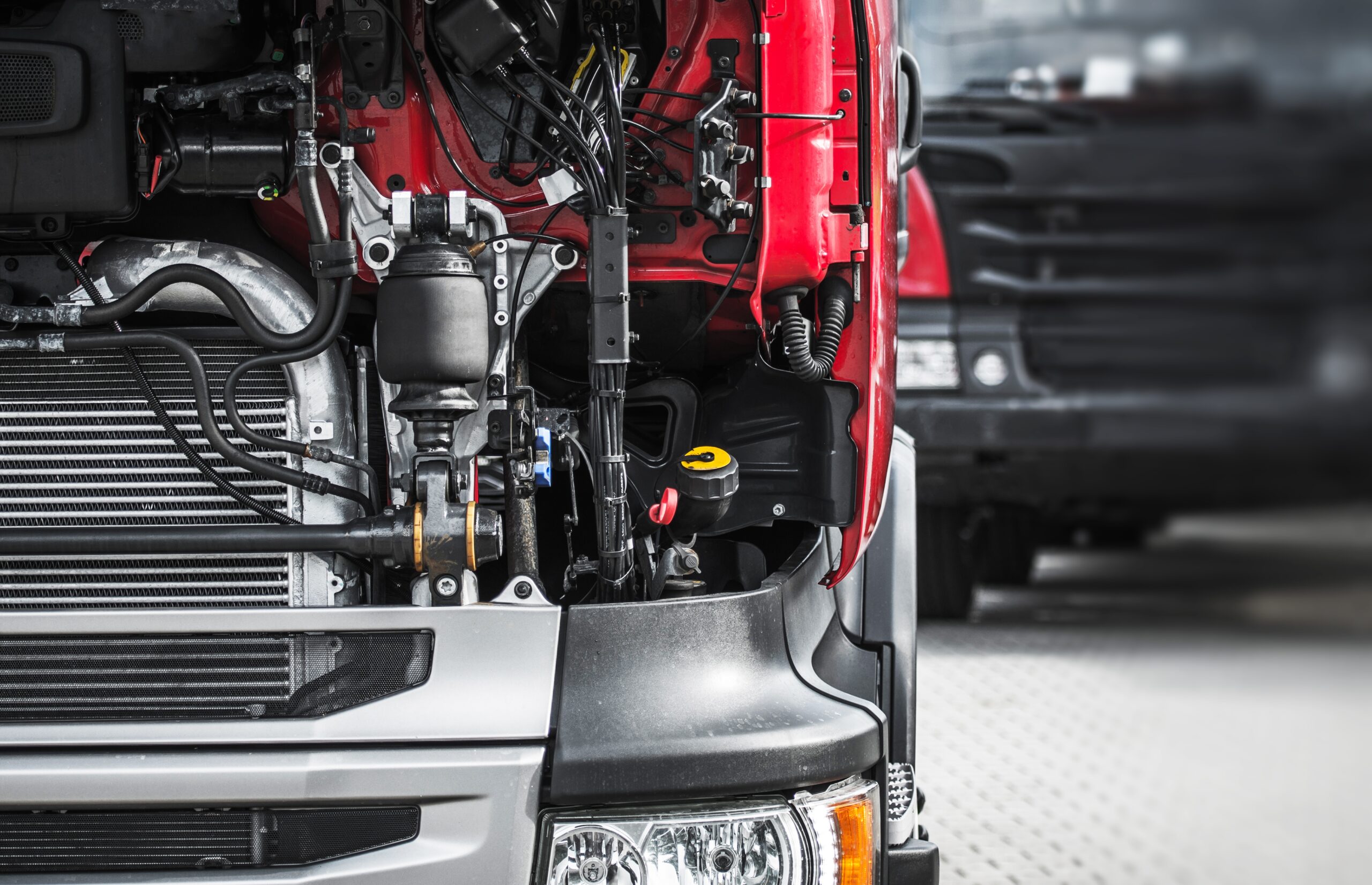 Broken Semi Truck Service Closeup Photo. Truck Maintenance Before Long Heavy Load Trip.